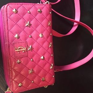 Pink  juicy couture . Wallet with strap.